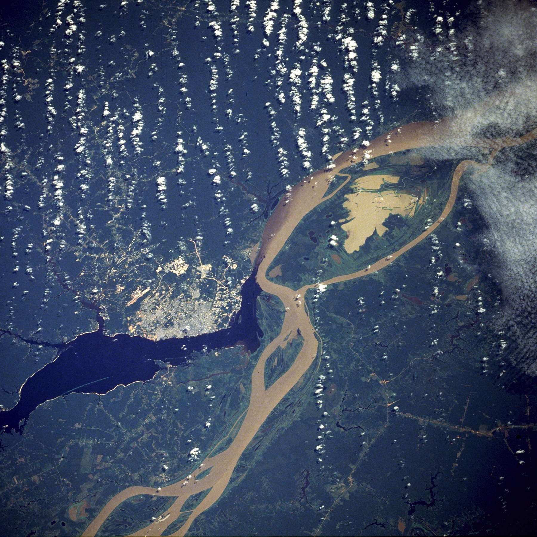 NASA satellite photo of Manaus at the Rio Negro and Amazon confluence, surrounded by rainforest
